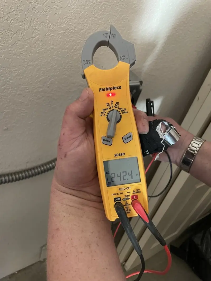 Voltage testing with clamp meter during Electrical Installation Services in Tallulah
